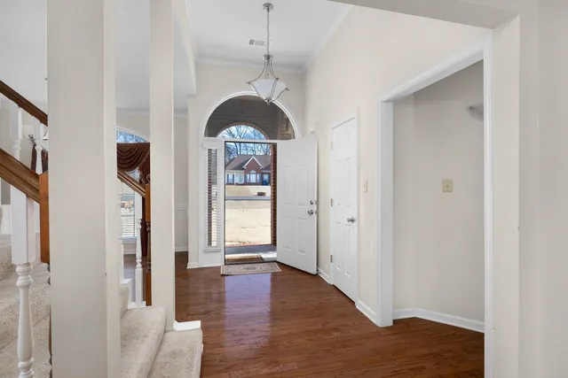a view of a hallway with staircase