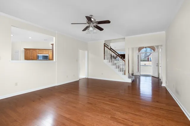a kitchen with stainless steel appliances a stove a sink and a microwave