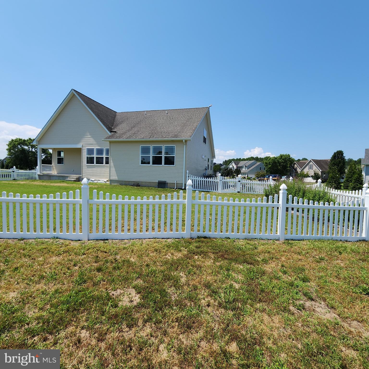 15050 Sandpiper Road Milton, DE 19968 - Photo 24 of 25 a view of a house with a small yard and fence