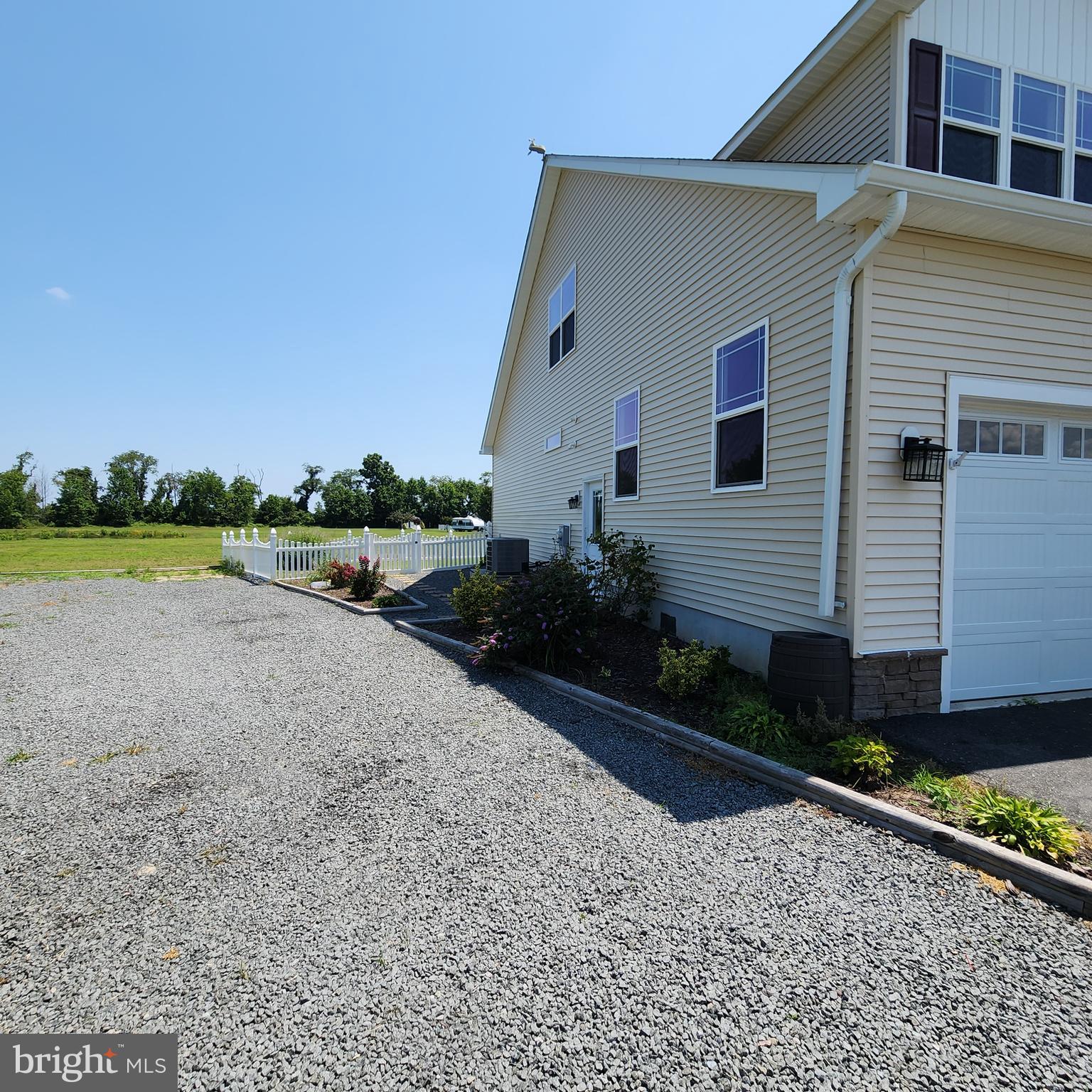 15050 Sandpiper Road Milton, DE 19968 - Photo 25 of 25 a view of a house with backyard and trees