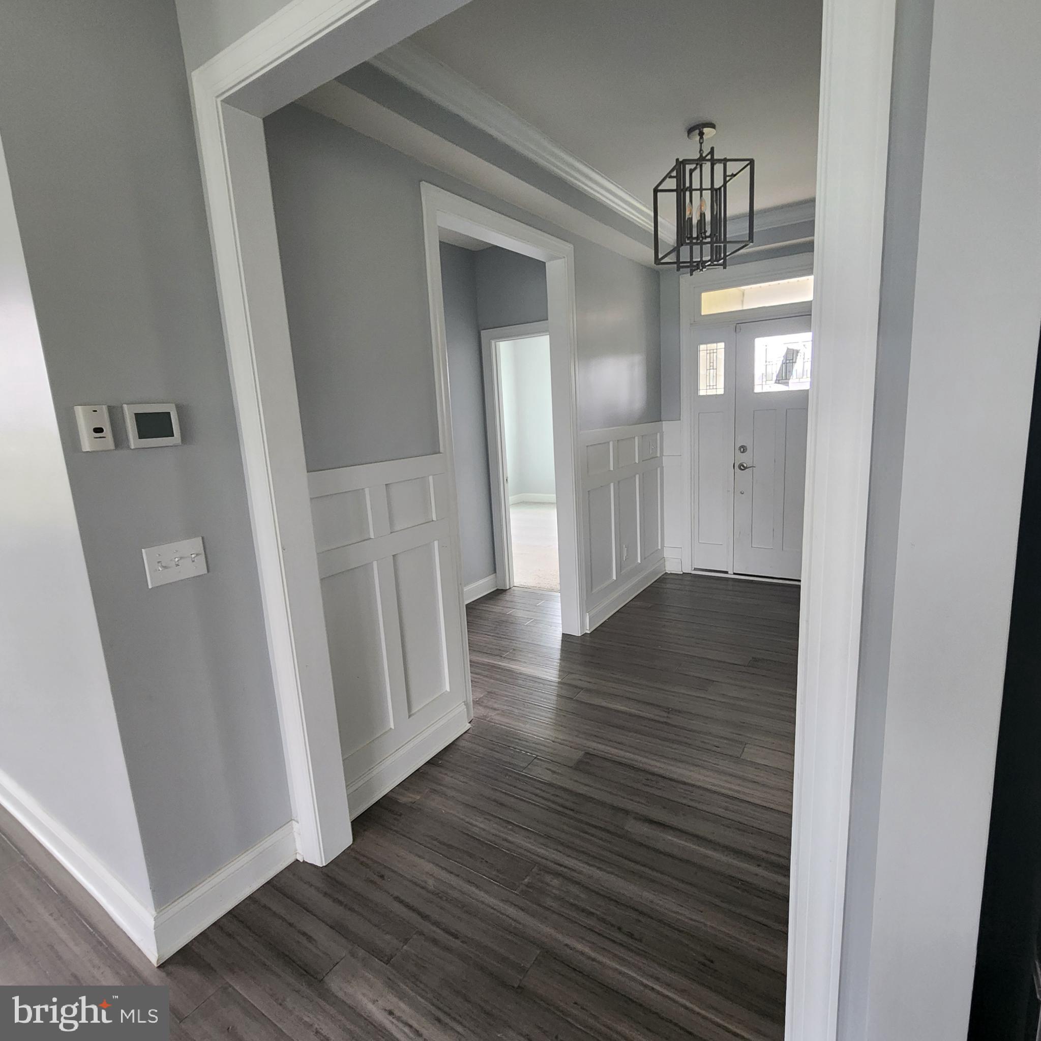 15050 Sandpiper Road Milton, DE 19968 - Photo 6 of 25 a view of entryway with wooden floor