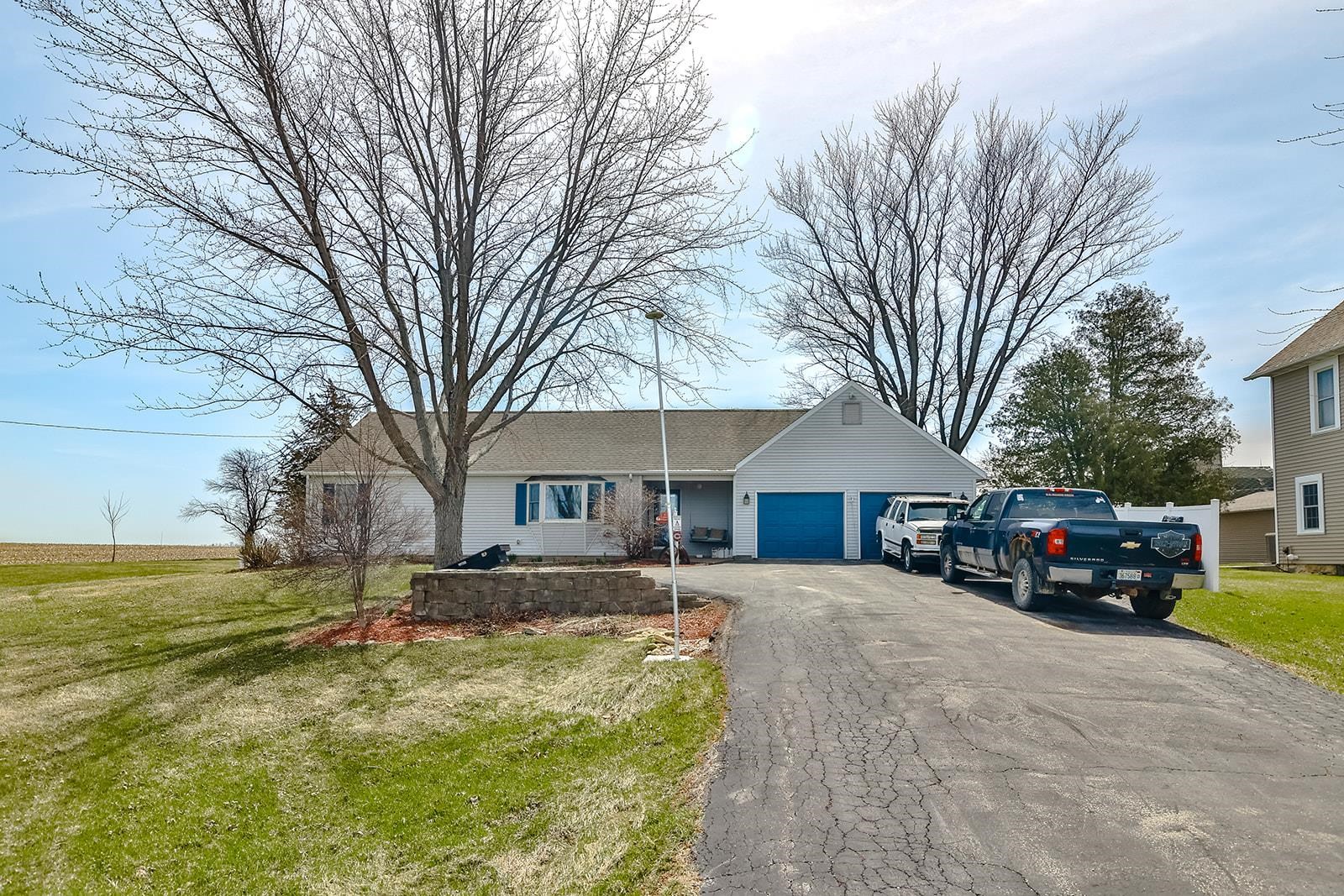 9563 East Center Road Stockton, IL 61085 - Photo 1 of 24 a view of a house with a yard covered in snow