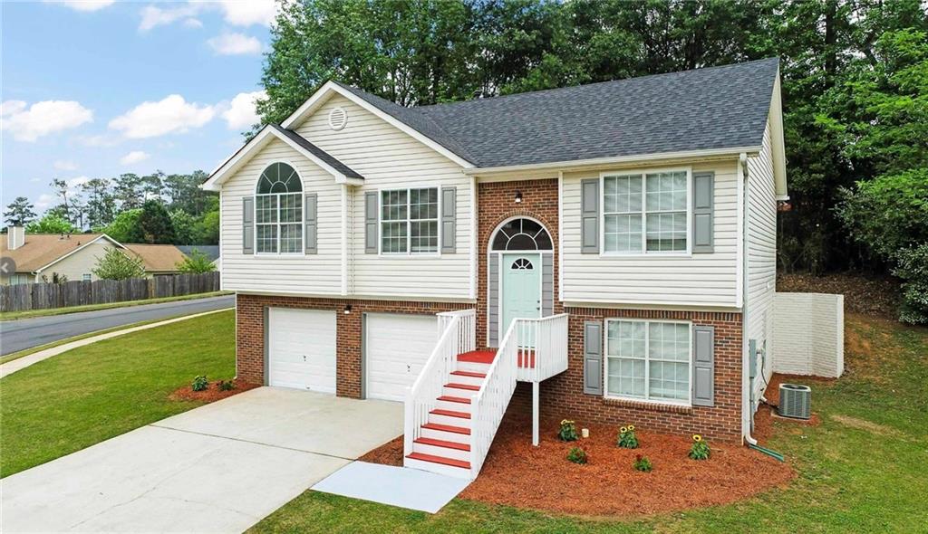a front view of a house with a yard