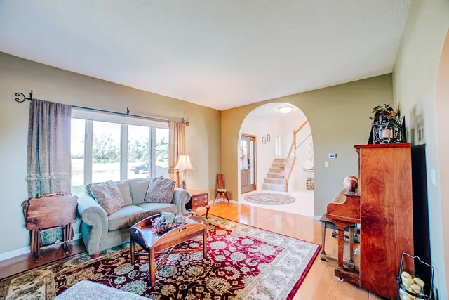 a view of a dining room with furniture and chandelier