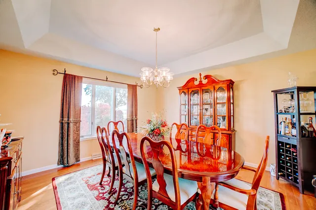 a kitchen with stainless steel appliances granite countertop a sink a stove and refrigerator