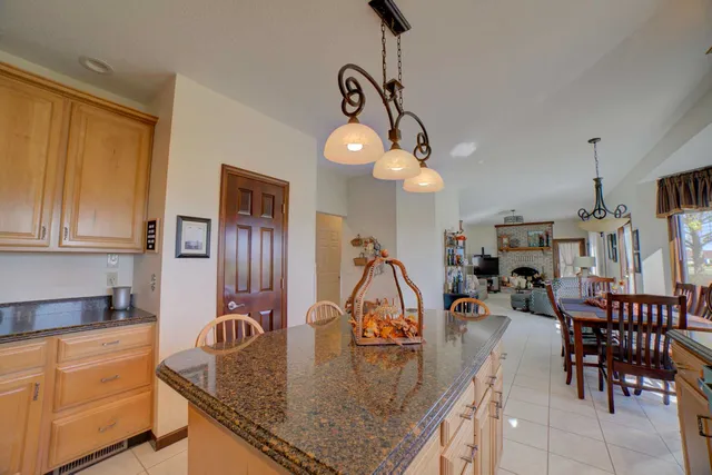 a bedroom with furniture and a flat screen tv