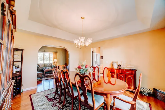 a kitchen with stainless steel appliances granite countertop a sink and a refrigerator