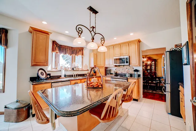 a room that has a bed and a chair in it