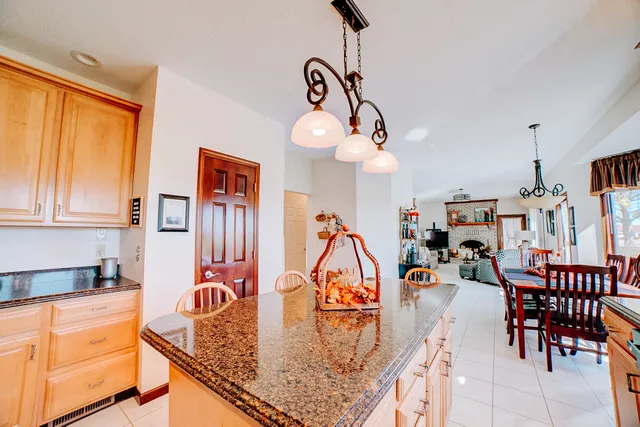 a bedroom with furniture and a flat screen tv