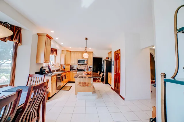 a bathroom with a bathtub and a window