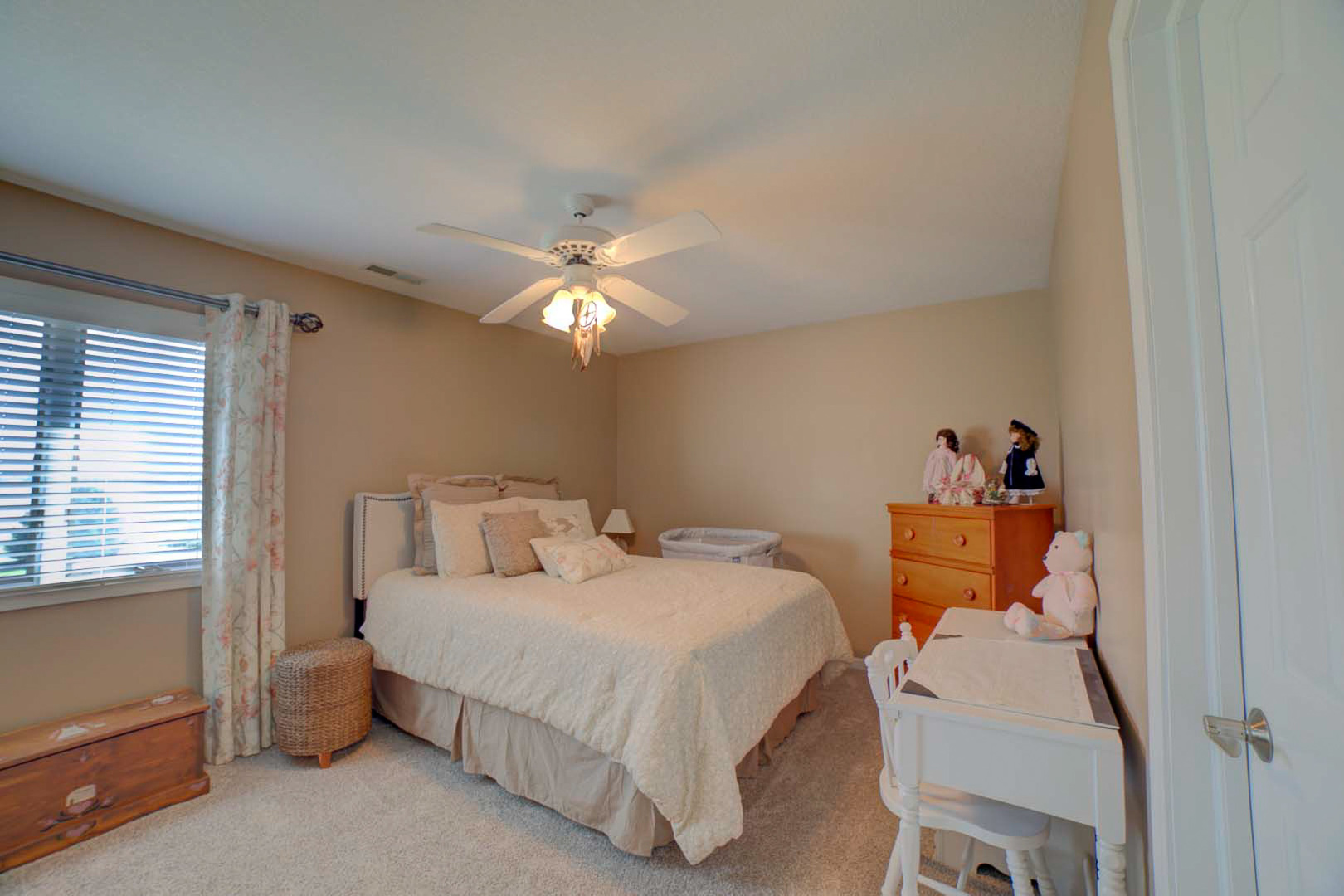 23 2130 East Watseka, IL 60970 - Photo 27 of 41 a bedroom with a bed and a chandelier
