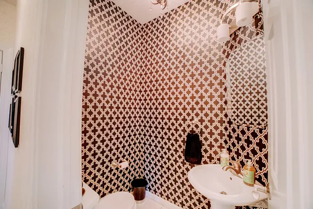a bathroom with a double vanity sink a mirror and a shower