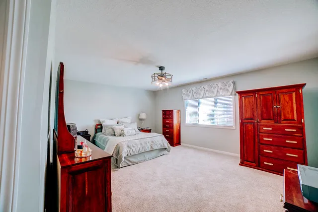 a living room with lots of furniture and a wooden floor