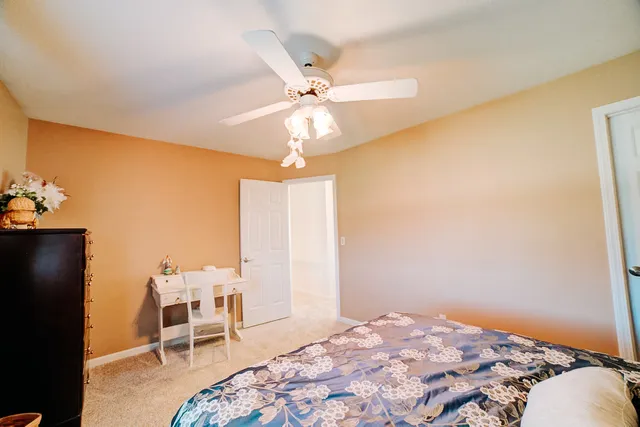 a view of a swimming pool with an outdoor seating and a yard