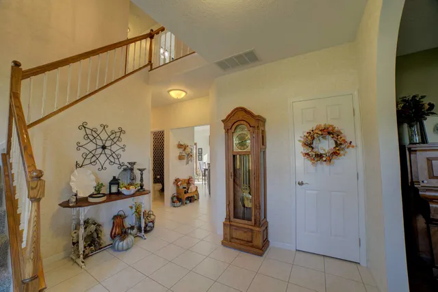 a view of a dining room with furniture and chandelier