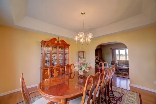 a bathroom with a toilet and a shower curtain