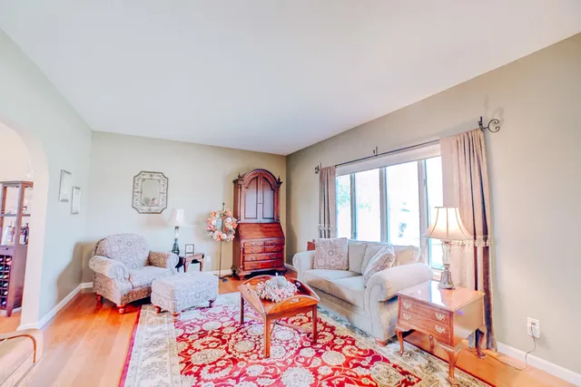 a dining room with furniture and a chandelier