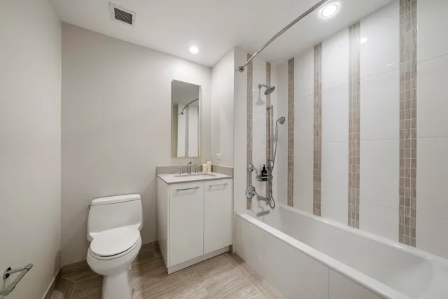 a lobby with furniture and a large window