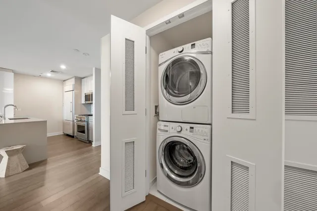 a view of a hallway with washer and dryer
