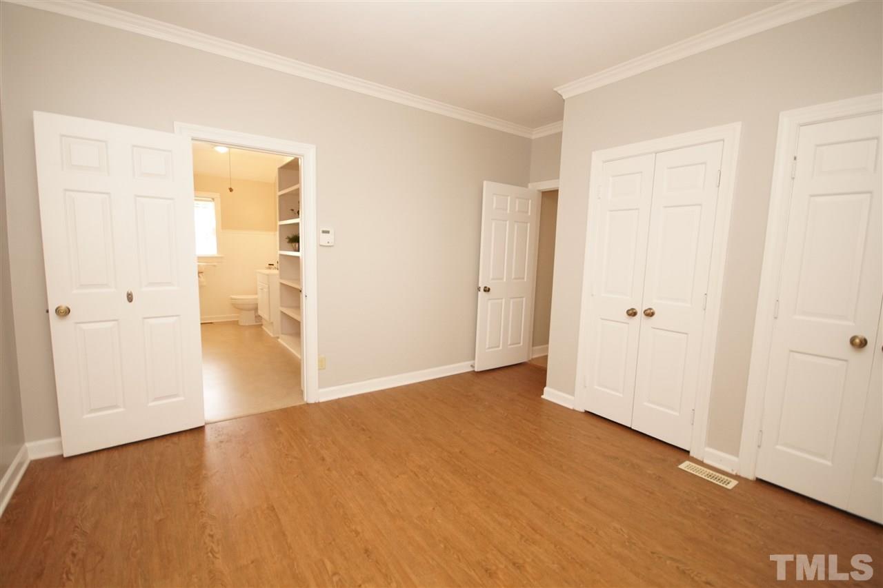 1729 Falls Church Road Raleigh, NC 27609 - Photo 18 of 25 a view of an empty room with wooden floor