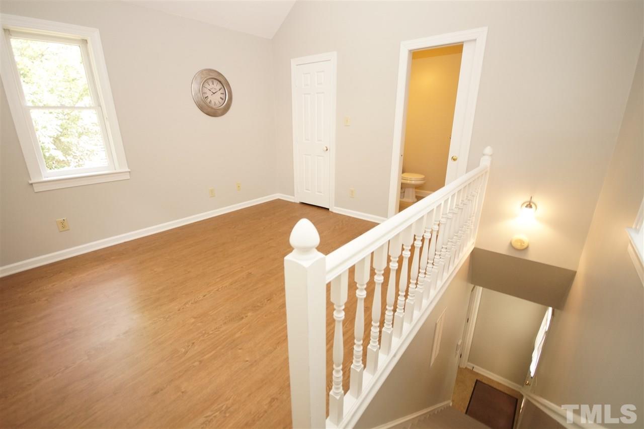 1729 Falls Church Road Raleigh, NC 27609 - Photo 20 of 25 a view of an empty room with wooden floor
