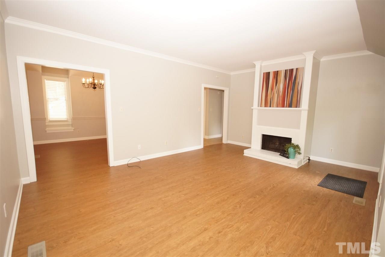 1729 Falls Church Road Raleigh, NC 27609 - Photo 4 of 25 a view of empty room with fireplace