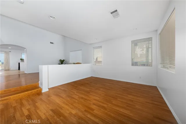 a bedroom with a bed and a night stand