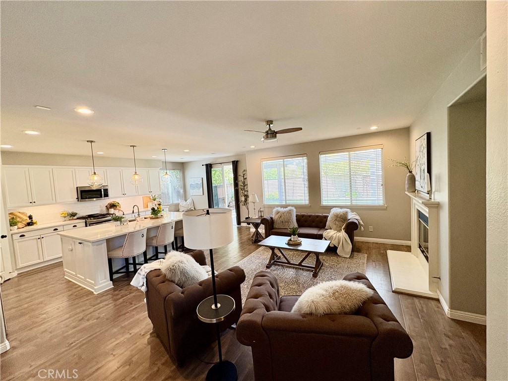 39707 Cambridge Place Temecula, CA 92591 - Photo 14 of 75 a living room with furniture kitchen view and a large window