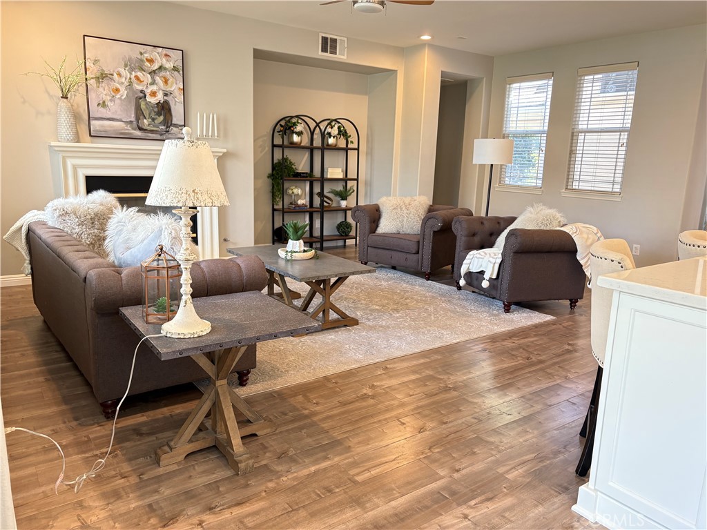 39707 Cambridge Place Temecula, CA 92591 - Photo 18 of 75 a living room with fireplace furniture and a large window