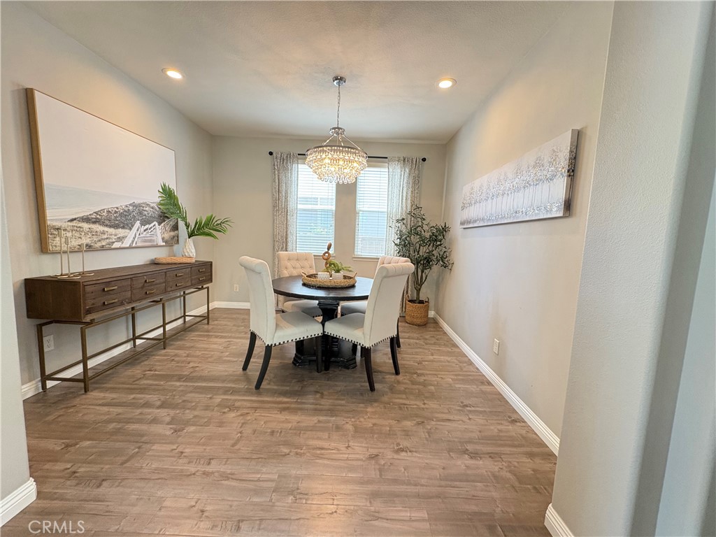 39707 Cambridge Place Temecula, CA 92591 - Photo 19 of 75 a view of a dining room with furniture window and wooden floor