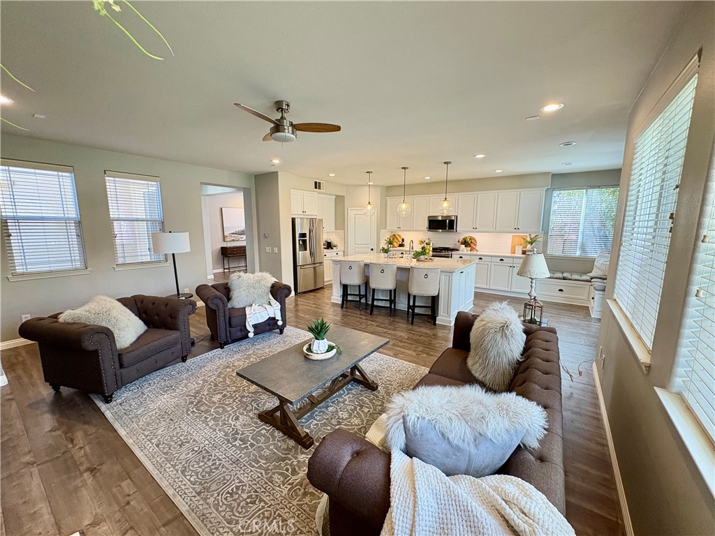 39707 Cambridge Place Temecula, CA 92591 - Photo 22 of 75 a living room with furniture and a large window