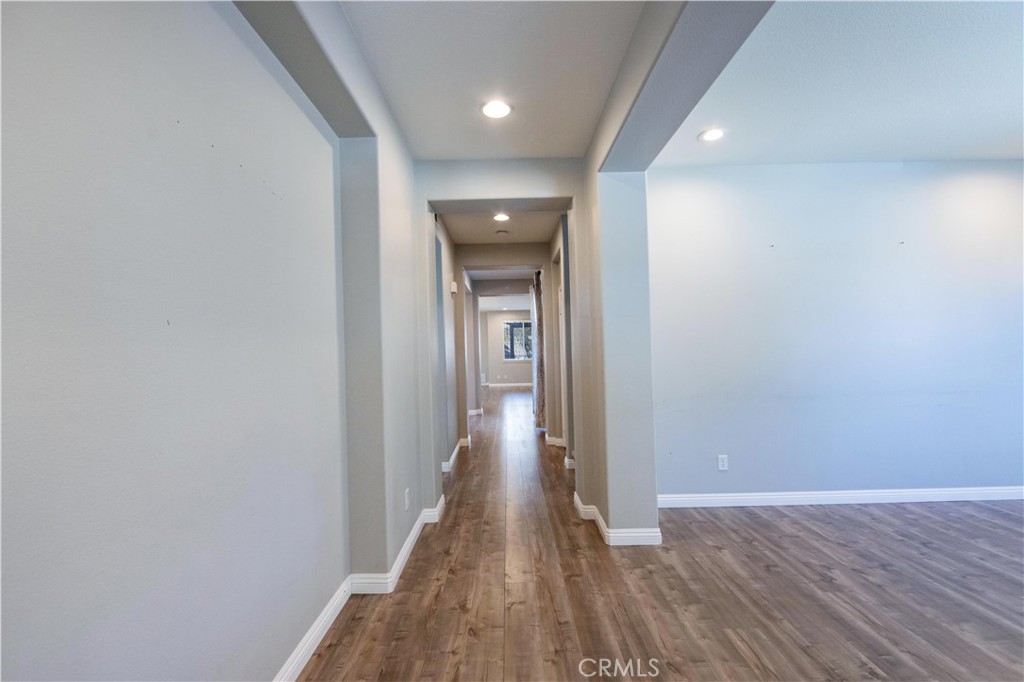 39707 Cambridge Place Temecula, CA 92591 - Photo 39 of 75 a view of a hallway with wooden floor