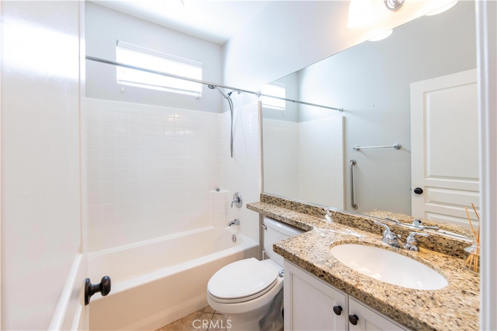 39707 Cambridge Place Temecula, CA 92591 - Photo 45 of 75 a bathroom with a granite countertop sink toilet and shower