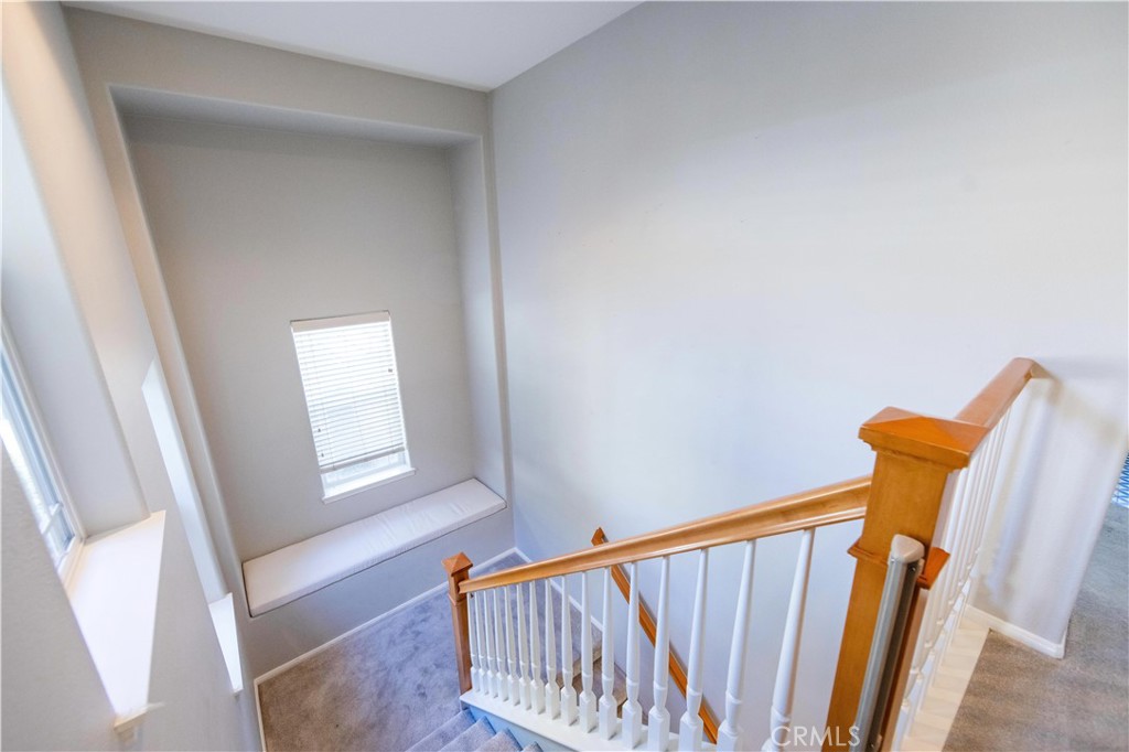39707 Cambridge Place Temecula, CA 92591 - Photo 50 of 75 a view of a hallway with windows