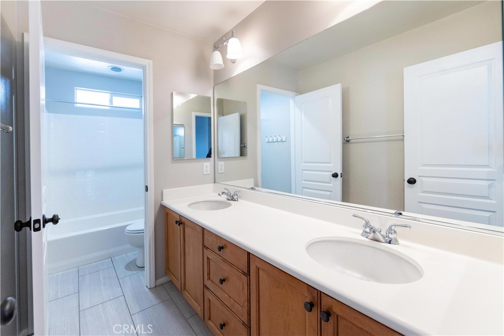 39707 Cambridge Place Temecula, CA 92591 - Photo 53 of 75 a bathroom with a double vanity sink mirror and double