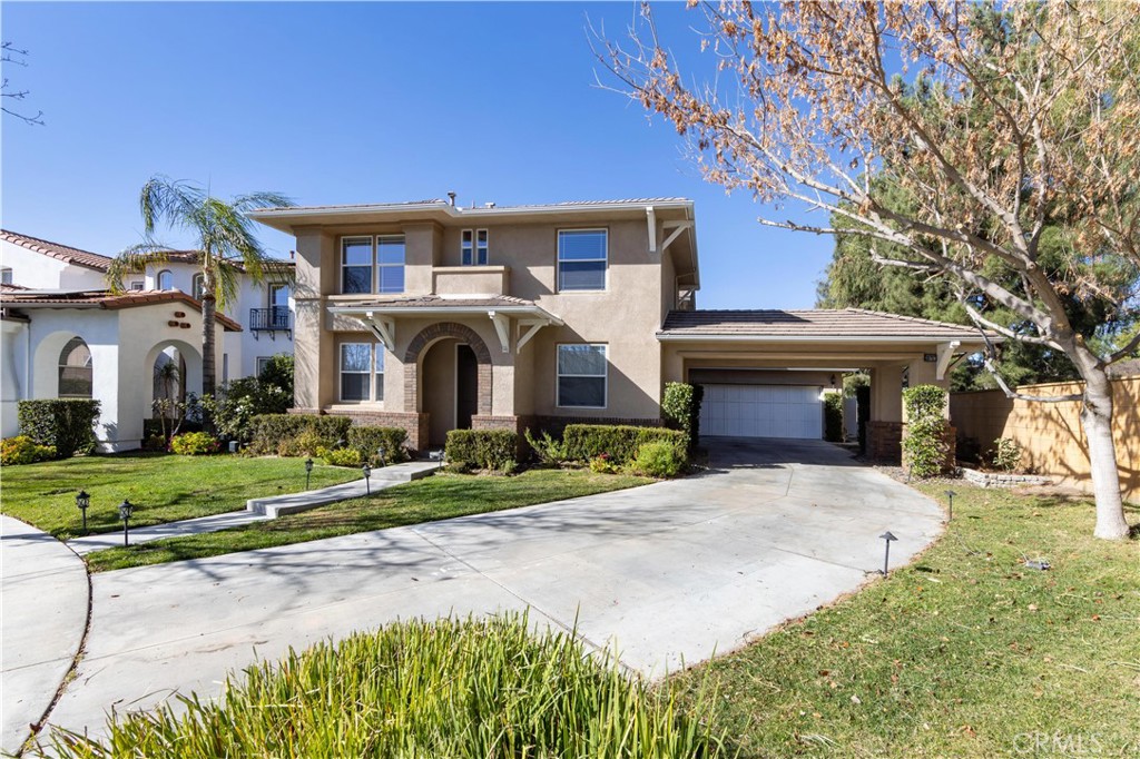 39707 Cambridge Place Temecula, CA 92591 - Photo 69 of 75 front view of a house with a yard