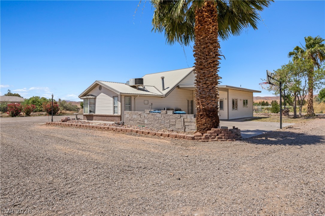 750 Leming Avenue Overton, NV 89040 - Photo 63 of 82 This desert dwelling offers spacious outdoor living with vast natural surroundings and a bright blue sky.