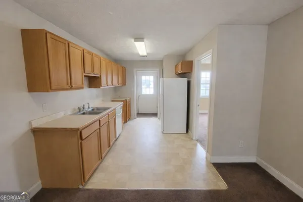 a view of a kitchen with cabinets