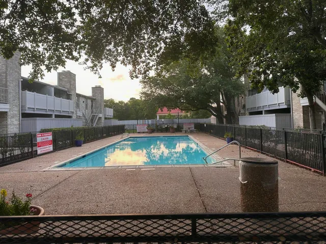 a view of a pool with an outdoor space