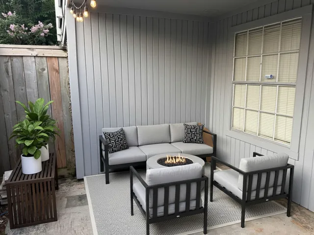 a outdoor living space with furniture and a potted plant