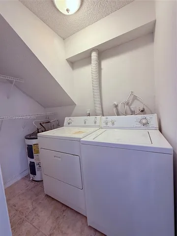 a view of a room with a cabinet and a window