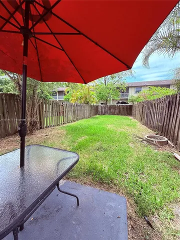 an empty room with wooden floor and closet