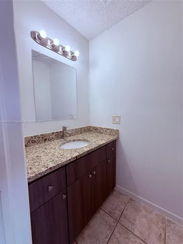 a white toilet sitting next to a bath tub