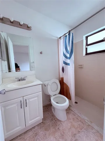 a kitchen with stainless steel appliances granite countertop a refrigerator and a stove