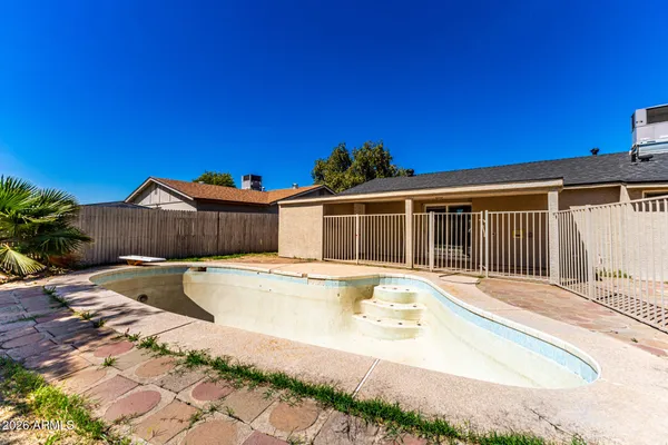 a front view of a house with swimming pool