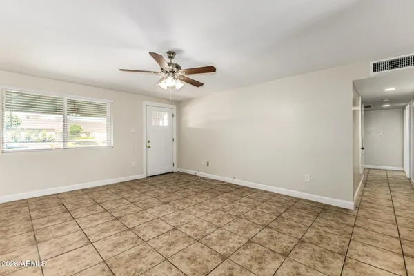 a view of an empty room and window
