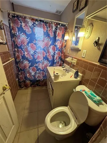 a bathroom with a toilet and a sink