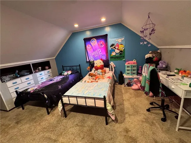 a room with furniture and a flat screen tv