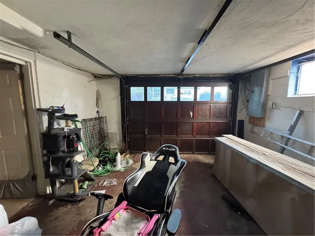 a view of a patio with table and chairs with wooden floor and fence