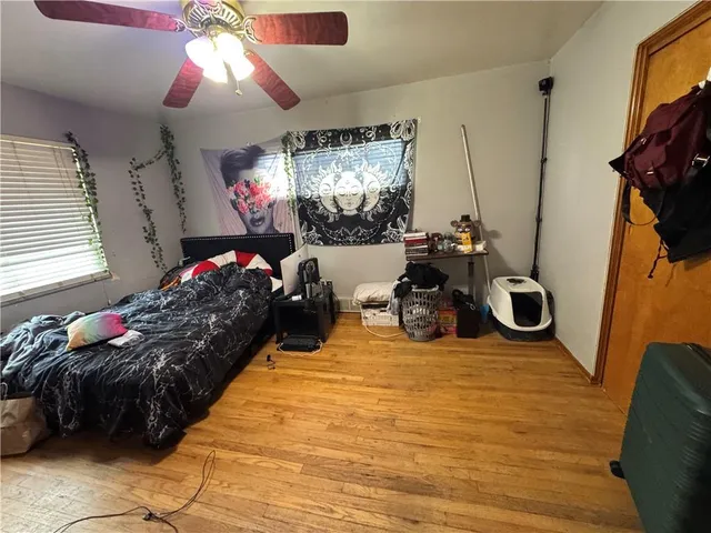 a bed room with a bed and a chandelier